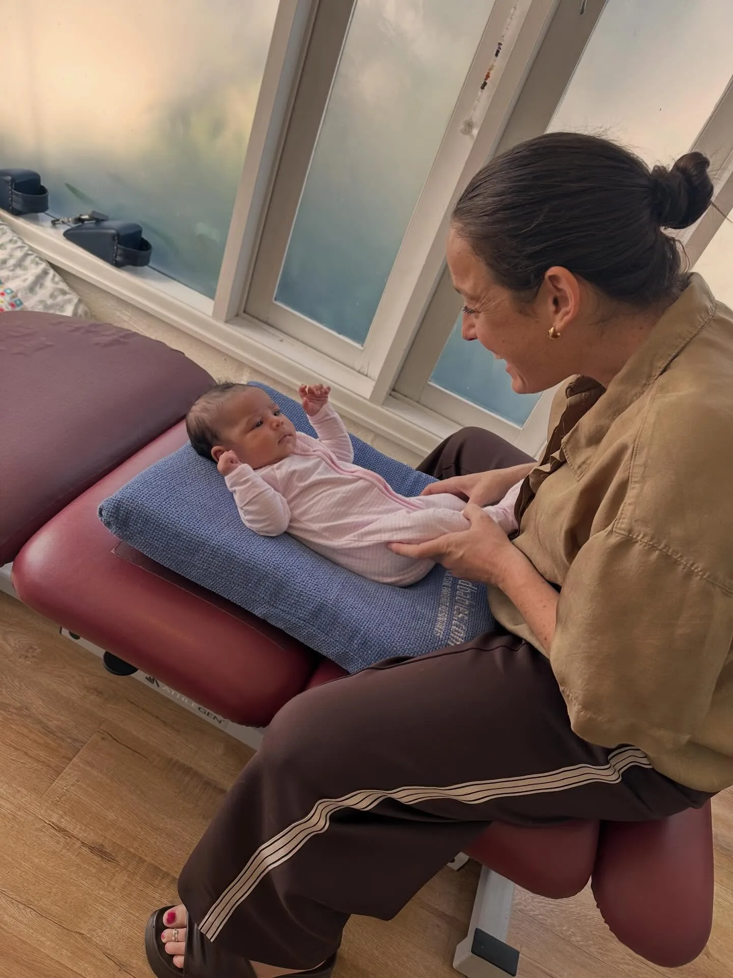 Paediatric chiropractic care — a practitioner gently treating an infant on the table